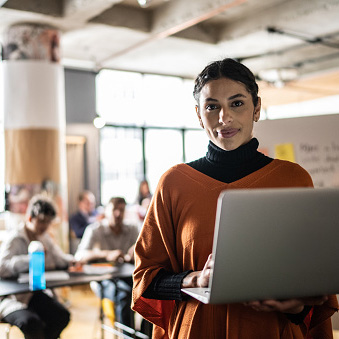 Women with laptop in a classroom