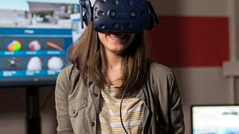 Student tries wearing virtual reality glasses
